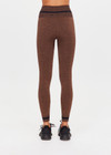 THE UPSIDE women's brown seamless Marle Seamless 25Inch Midi Legging offers a mid-rise with a black stripe at waistband. Made for yoga & pilates.