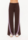 THE UPSIDE women's brown Roma Pant features a high rise with an elasticated waistband, pockets, and a side stripe with lilac mesh. Made from recycled double faced single jersey fabrication. Made for lifestyle.