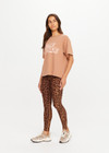 THE UPSIDE women’s brown 100% organic cotton Jacob Tee is designed for an oversized fit and features a ribbed collar and printed logo detail. Made for lifestyle.