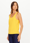 THE UPSIDE women’s yellow recycled mesh Issy Tank Top is a regular fit racerback tank and features a scoop neckline and longline silhouette. Made for performance.