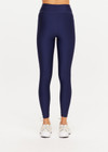THE UPSIDE women’s navy recycled Eco Tech Salvador 25inch Midi Legging is mid rise and features side seam pockets, a cuffed hem and drawcord waist. Made for yoga and pilates.