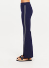 THE UPSIDE women’s navy sustainable Joyela Panelled Flare Pant is mid rise and features an internal elasticated waistband, front and back darts and contrast side stripe tape. Made for lifestyle.