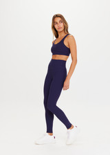 THE UPSIDE women's navy blue Peached 28inch High Rise Pant is a sustainable 28inch full length legging in our recycled soft peached fabric with a V shaped high-rise waistband.
