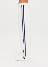 THE UPSIDE Jupiter Pant in White is a sustainable wide leg pant with pintuck detailing, knitted striped tape down side seams, pockets and elastic at waist.
