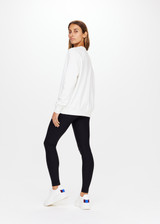THE UPSIDE women's white Newport Crew is made for a relaxed fit with organic cotton french terry and features ribbed neck, cuffs and waist.