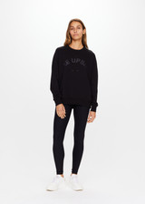 THE UPSIDE women's black Newport Crew is made for a relaxed fit with organic cotton french terry and features ribbed neck, cuffs and waist.