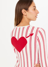THE UPSIDE Alpine Chrissy Knit Top in Striped Red and White is a sustainable lightweight knit top with vertical stripe design, mini frill detail at cuff and intarsia heart and arrow at back.