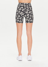 THE UPSIDE Bloom 5inch Spin Short in Floral is a recycled soft peached mid-rise spin short which is breathable and moisture wicking.