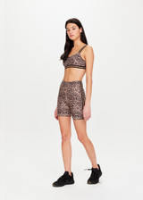 THE UPSIDE Ryker 6inch Spin Short in Leopard print is a sustainable mid-rise 6inch length spin short with contrast printed arrow at centre back and striped elastic down sides.