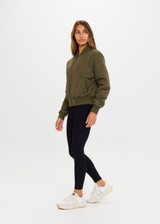 THE UPSIDE Kita Bomber Jacket in Khaki is sustainable classic bomber jacket with pockets, zip front closure, recycled insulation, and PCR free water repellent coating.