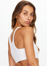 THE UPSIDE Peached Jade Bra in White is a sustainable scoop neck full coverage T back bra with internal elastic underbust and removable cups.