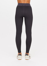 THE UPSIDE Ribbed Seamless 25inch Midi Pant in Black is a mid-rise 25inch midi length legging in a two tone seamless black and charcoal rib fabrication with a contrast knitted waistband.