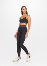 THE UPSIDE Ribbed Seamless 25inch Midi Pant in Black is a mid-rise 25inch midi length legging in a two tone seamless black and charcoal rib fabrication with a contrast knitted waistband.