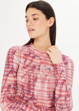 THE UPSIDE Luella Long Sleeve in our Tie Dye print is a sustainable fitted long sleeve top with raw edge seam detail and a mock neck.