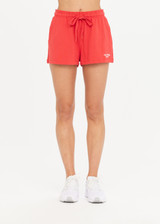 THE UPSIDE Courtsport Zippy Short in Chilli Red is a sustainable classic gym short with side seam and back patch pockets and elastic drawstring at waist.