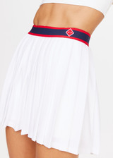 THE UPSIDE Deuce Sloan Skirt in White is a sustainable pleated tennis skirt with a ribbed stripe waistband with zipper opening and inner short with pocket.