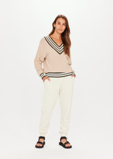 THE UPSIDE Pilot Louie Sweater Pebble Brown is a sustainable organic cotton knit sweater with a deep “V” neckline and knitted stripes through the rib cuffs, neckline and hem.