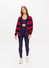 THE UPSIDE Roosevelt Piper Knit Cardigan in Navy and Red Stripes is a sustainable organic cotton longline “V” neck knit cardigan with pockets and button front opening.