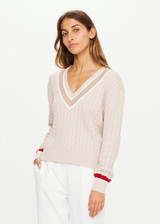 THE UPSIDE Trophy Sonny Knit Sweater in Malt is a sustainable organic cotton classic V neck knit with knitted stripes at sleeve hem and neckline.