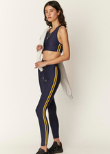 THE UPSIDE Oxford 25inch Midi Pant in Navy is a sustainable mid-rise 25” length legging with contrast binds at sides and drawcord waistband.