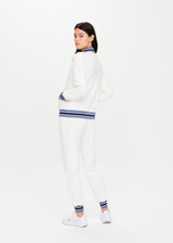 THE UPSIDE Bounce Quinn Jacket in White is a sustainable organic cotton fully lined zip through jacket with pockets, raglan sleeves and stripe rib collar, cuffs and hem.