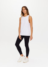 THE UPSIDE White Quick Dry Sarah Tank is made from a recycled dri release fabrication in black and designed for a relaxed fit and features sweat wicking and quick drying properties.