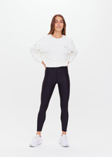 THE UPSIDE women's black Supersoft 25inch Pocket Midi Pant is a mid rise, 7/8 length, super soft legging is made from breathable, quick drying and moisture wicking fabric with a 4-way stretch. It features a stretch drawcord through the waistband and a print arrow at the centre back waistband.