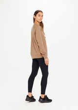 THE UPSIDE women’s brown Newport Crew, made with organic cotton french terry fabric, features a relaxed-fit, rib neck, cuffs and waist, and a tonal printed horseshoe logo on front.