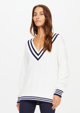 THE UPSIDE womens ivory and navy v-neck Louie Sweater made with organic cotton features a mid-weight knit construction and contrast navy stripes on neckline, cuffs and hems.