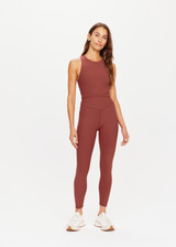 THE UPSIDE womens red-brown Ribbed 25In Midi Pant made with Ultra Soft Recycled Rib fabric features a v-shaped high rise waistband, designed for everyday support and wear.