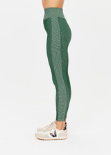 THE UPSIDE womens two-toned green pine/matcha Rib Seamless 25 Inch Midi Pant made with Ribbed Seamless fabric features soft support, reverse ribbed side panels and moisture control properties.