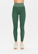 THE UPSIDE womens two-toned green pine/matcha Rib Seamless 25 Inch Midi Pant made with Ribbed Seamless fabric features soft support, reverse ribbed side panels and moisture control properties.