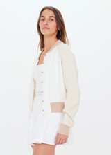 THE UPSIDE womens white/beige/neutral Rodeo Hallie Knit Bomber features welt pockets, contrast sleeves and knitted rib at hem, neck and cuffs.