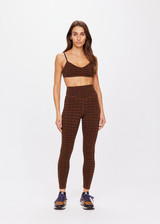 THE UPSIDE women's tobacco brown Obsidian 25 Inch High Midi Pant made with Recycled Jacquard rib fabrication in ‘T’ monogram print design features a high waisted v-front, 25 inch leg length, arrow logo at centre back and moisture wicking properties.