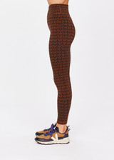 THE UPSIDE women's tobacco brown Obsidian 25 Inch High Midi Pant made with Recycled Jacquard rib fabrication in ‘T’ monogram print design features a high waisted v-front, 25 inch leg length, arrow logo at centre back and moisture wicking properties.