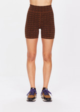 THE UPSIDE women's tobacco brown Obsidian 5In Spin Short made with Recycled Jacquard rib fabrication in ‘T’ monogram print design features a mid-rise 5 inch leg length, arrow logo at centre back and moisture wicking properties.