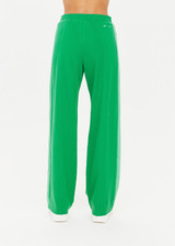 THE UPSIDE women's green Drifter Jupiter Pant made in soft lenzing viscose fabrication features a wide-leg sporty fit, knitted striped tape down side seams, side pockets, an elasticated waist, and contrast embroidered logo on back.