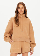 THE UPSIDE women's tan/dune Tecopa Mason Hoodie made with organic cotton loopback fabric features an oversized relaxed fit, a hood with drawcords, embroidered horseshoe logo on front, and ribbed cuffs and hemband.
