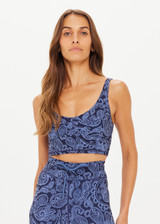 THE UPSIDE women's mid-coverage indigo paisley pattern Nouveaux Candice Crop made in Recycled Soft Peached features a long-line fit, subtle panelling, printed arrow logo at back and moisture wicking properties.