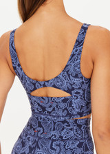 THE UPSIDE women's mid-coverage indigo paisley pattern Nouveaux Candice Crop made in Recycled Soft Peached features a long-line fit, subtle panelling, printed arrow logo at back and moisture wicking properties.