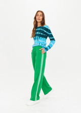 THE UPSIDE women's Tie Dye Amana Long Sleeve Knit made in 100% organic cotton features a lightweight construction, hues of blue and emerald and arrow logo pip at cuff; perfect for mid-seasonal layering.