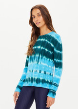 THE UPSIDE women's Tie Dye Amana Long Sleeve Knit made in 100% organic cotton features a lightweight construction, hues of blue and emerald and arrow logo pip at cuff; perfect for mid-seasonal layering.