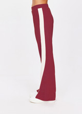 THE UPSIDE women's maroon Petra Flare is a flared pant with splits at front, contrast knitted cream tape down side seams cream tape down the side seams, pockets and elastic at waist.