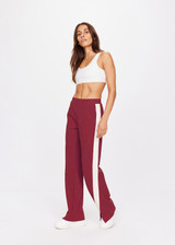THE UPSIDE women's maroon Petra Flare is a flared pant with splits at front, contrast knitted cream tape down side seams cream tape down the side seams, pockets and elastic at waist.