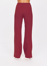 THE UPSIDE women's maroon Petra Flare is a flared pant with splits at front, contrast knitted cream tape down side seams cream tape down the side seams, pockets and elastic at waist.