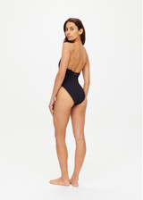 THE UPSIDE women’s chai brown Banya Flow classic One Piece swimsuit is made from recycled fabric and features a scoop front and back neckline, high shaped legline and adjustable straps.