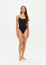 THE UPSIDE women’s chai brown Banya Flow classic One Piece swimsuit is made from recycled fabric and features a scoop front and back neckline, high shaped legline and adjustable straps.