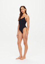 THE UPSIDE women’s chai brown Banya Flow classic One Piece swimsuit is made from recycled fabric and features a scoop front and back neckline, high shaped legline and adjustable straps.