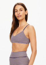 THE UPSIDE women's stripe print Solace Zoe Bra is made with Recycled Rib fabric designed for a supportive fit. This low-coverage bra features adjustable straps, ideal for yoga.