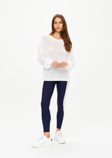 THE UPSIDE women's creme Fenway Sebastian Knit Crew is made with open knit organic cotton, for a relaxed fit. This long sleeve crew neck features a ribbed neckline and cuffs.